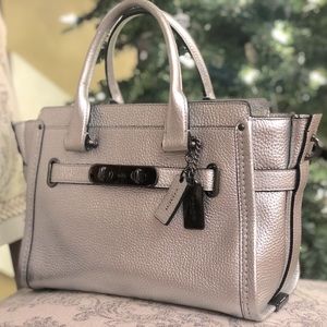 Coach Leather Silver Holiday Bag circa 2016, 8.5” high and 12-14” wide.